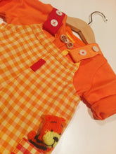 Load image into Gallery viewer, Dungaree in orange plaid pattern with pockets