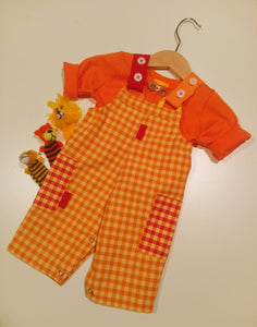 Dungaree in orange plaid pattern with pockets