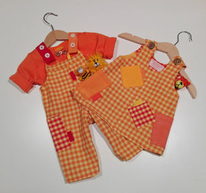 Dungaree in orange plaid pattern with pockets